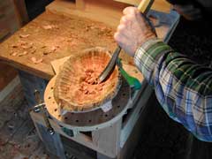 Using gouge to carve out the inside of the bowl
