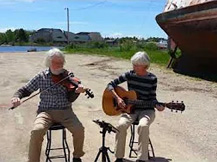 Steve & Sue playing at Manistique Harbor