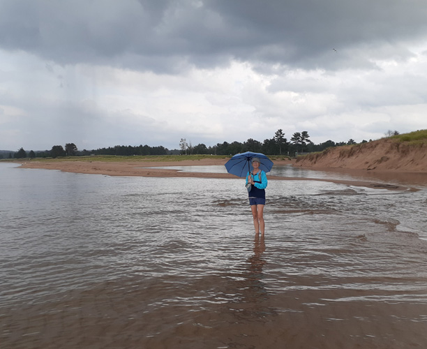 hiking in rain at AuTrain Beach Sept. 18, 2022